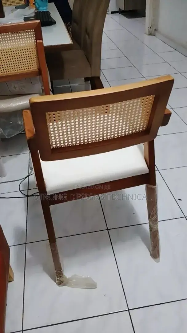 A Pair Of 2 Rattan Dining Chair