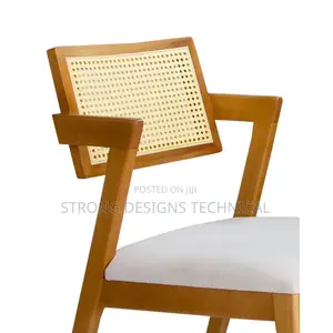 A Pair Of 2 Rattan Dining Chair