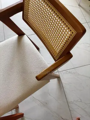 A Pair Of 2 Rattan Dining Chair