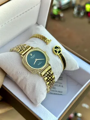 Women's Green Face Golden Strapped Rolec Time Piece With Its Bracelet