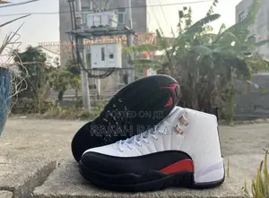 Original White/Black/Red Air Jordan 12 Retro “Tax Flip” Sneaker
