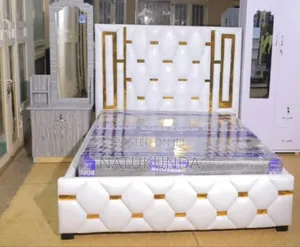 White Bed With Golden Stickers