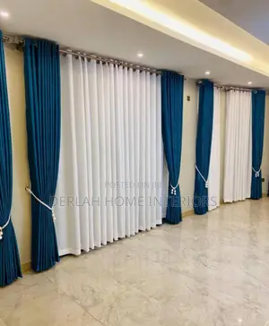 Soft Blue Curtains and Plain White Nets