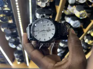 Black Mens Patek Phillipe Watch With a White Dail