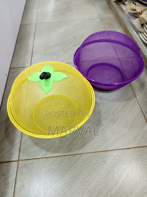 An Apple-Shaped Mesh Fruit Basket With a Lid.