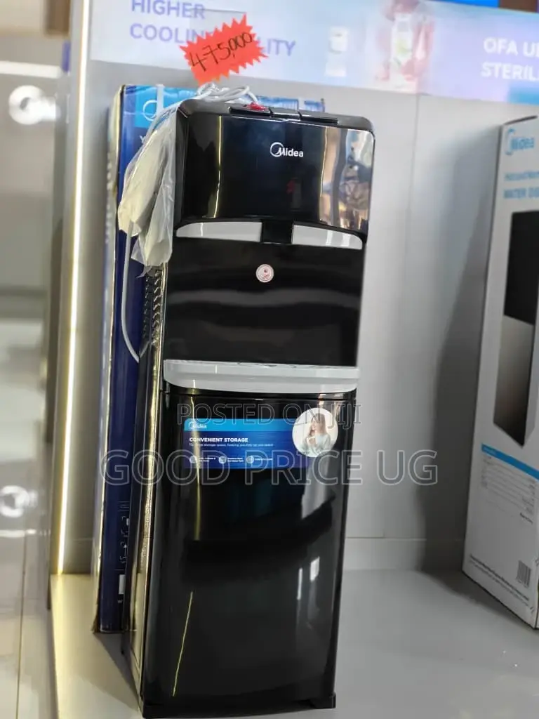 A Black Midea Yl1632s Top Loading Water Dispenser With Bottom Cabinet