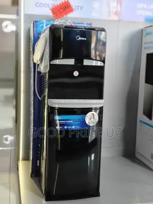 A Black Midea Yl1632s Top Loading Water Dispenser With Bottom Cabinet