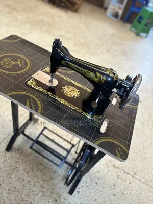 Well Serviced Singer Sewing Machine New in the Box With Local Stand