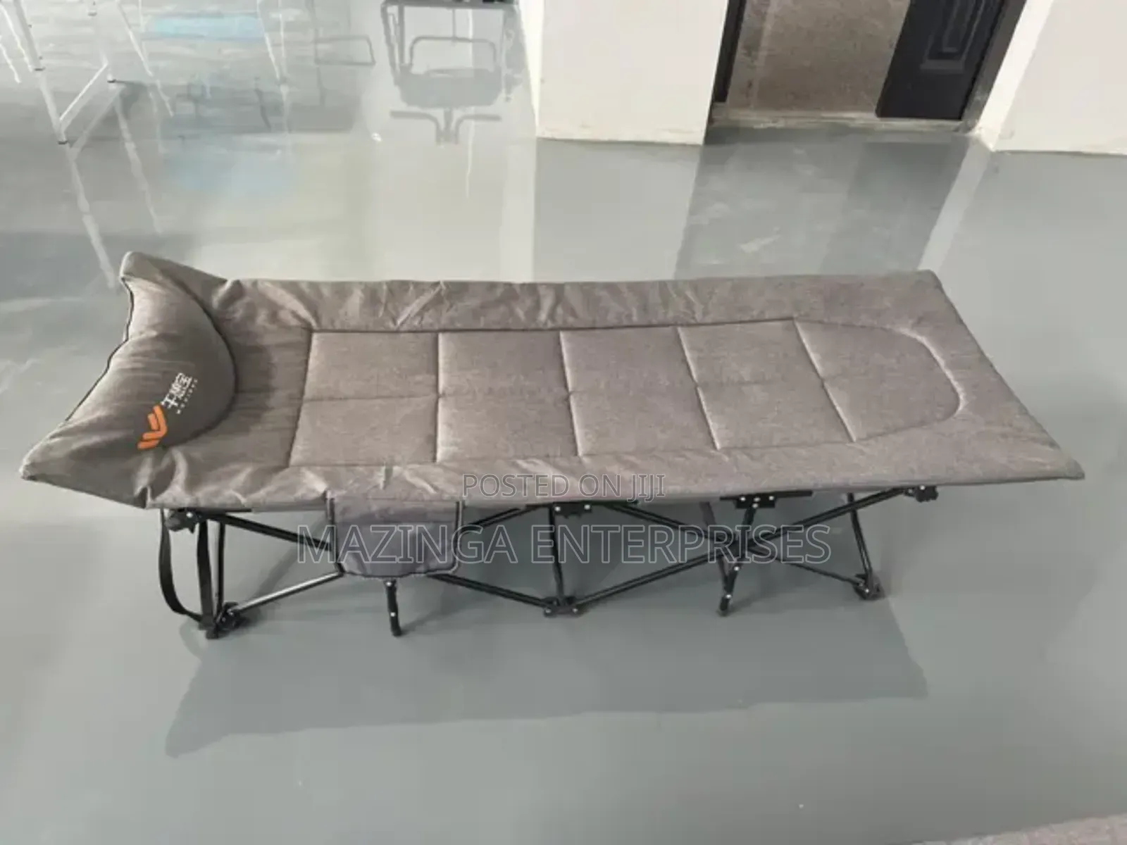 Portable Folding Camping Bed Cot With a Padded Mattress.