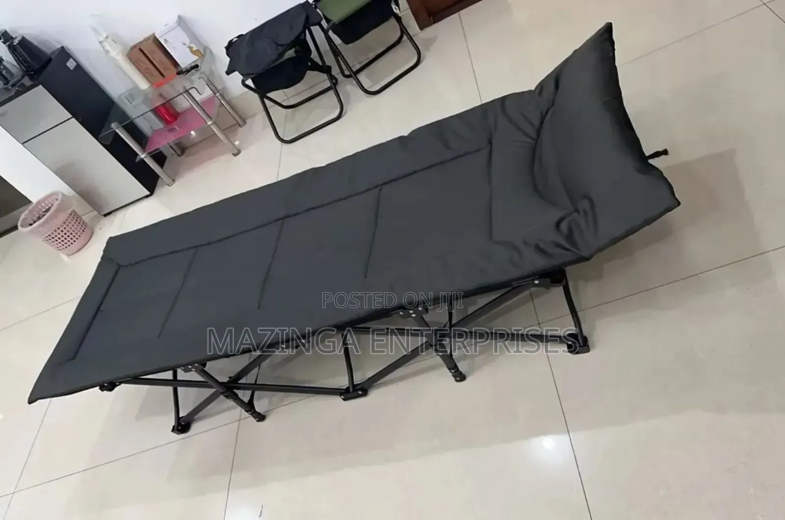 Portable Folding Camping Bed Cot With a Padded Mattress.