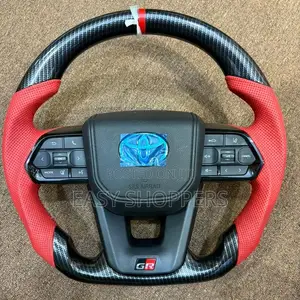 Toyota (Gr) Steering Wheel With Red Leather and Carbon Fiber Wrapping.