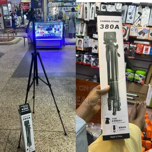 A Box for a 380a Camera and Mobile Phone Tripod Stand