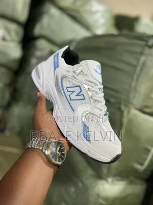 New Balance 530 Sneaker in White With Light Blue and Silver Accents