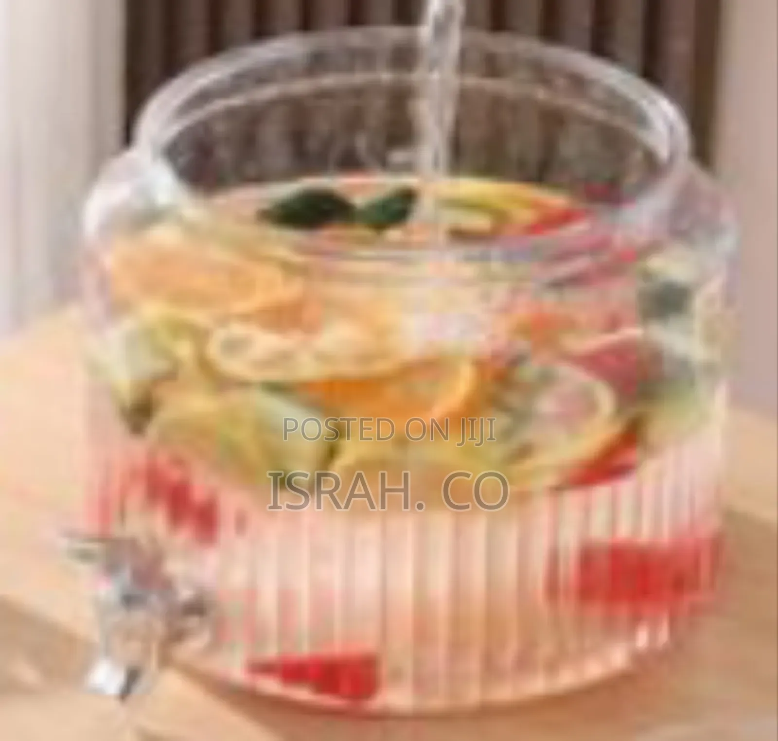 Ribbed Glass Beverage Dispenser With a Spigot
