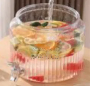 Ribbed Glass Beverage Dispenser With a Spigot