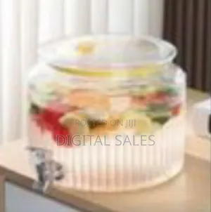 Ribbed Glass Beverage Dispenser With a Spigot.