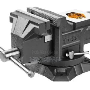 Heavy-duty Bench Vise With A Swivel Base And Anvil.