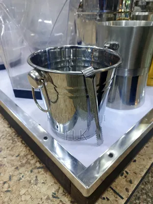 Stainless Steel Ice Bucket With Accompanying Tongs.