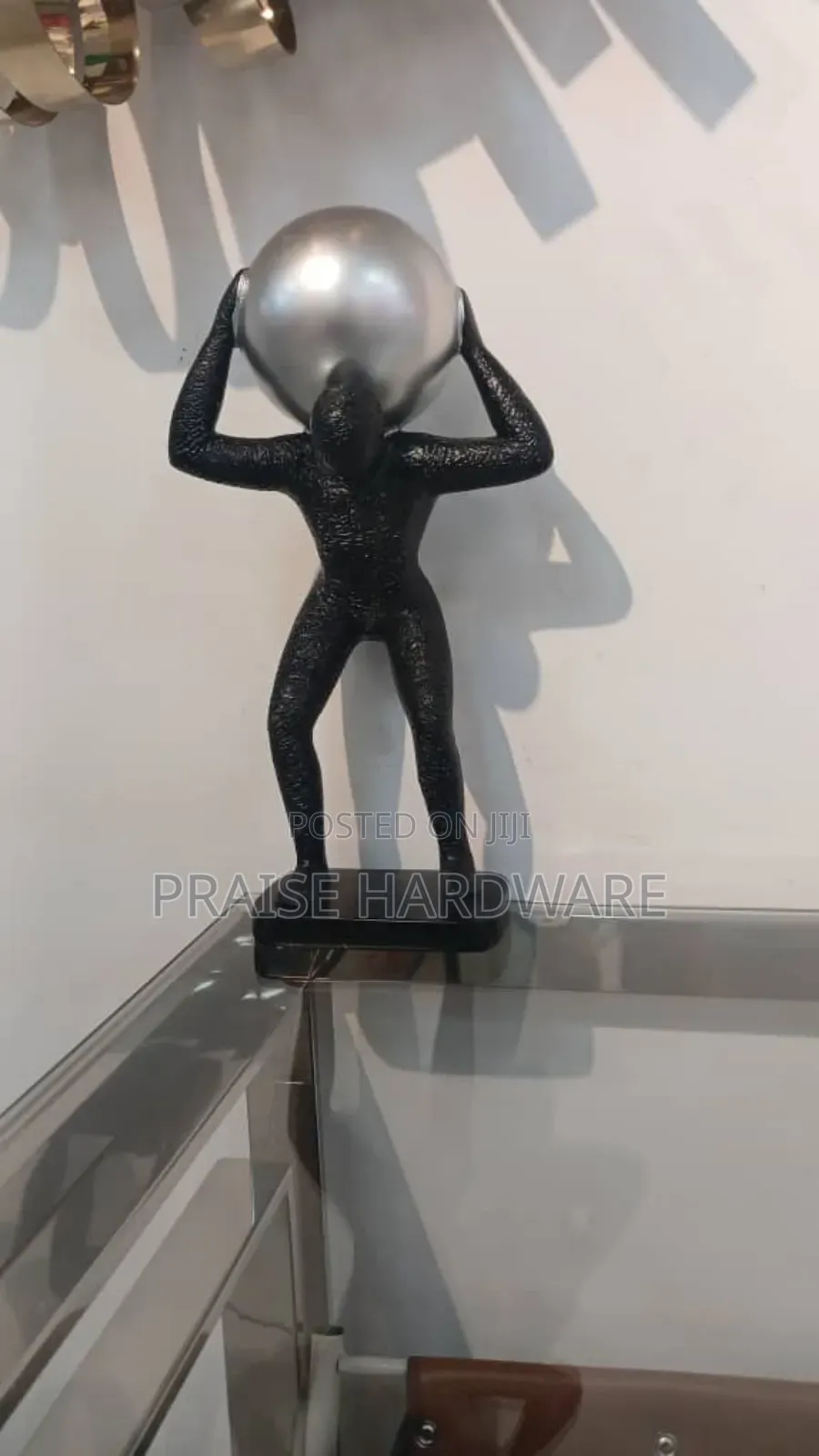 Man Carrying Globe Black