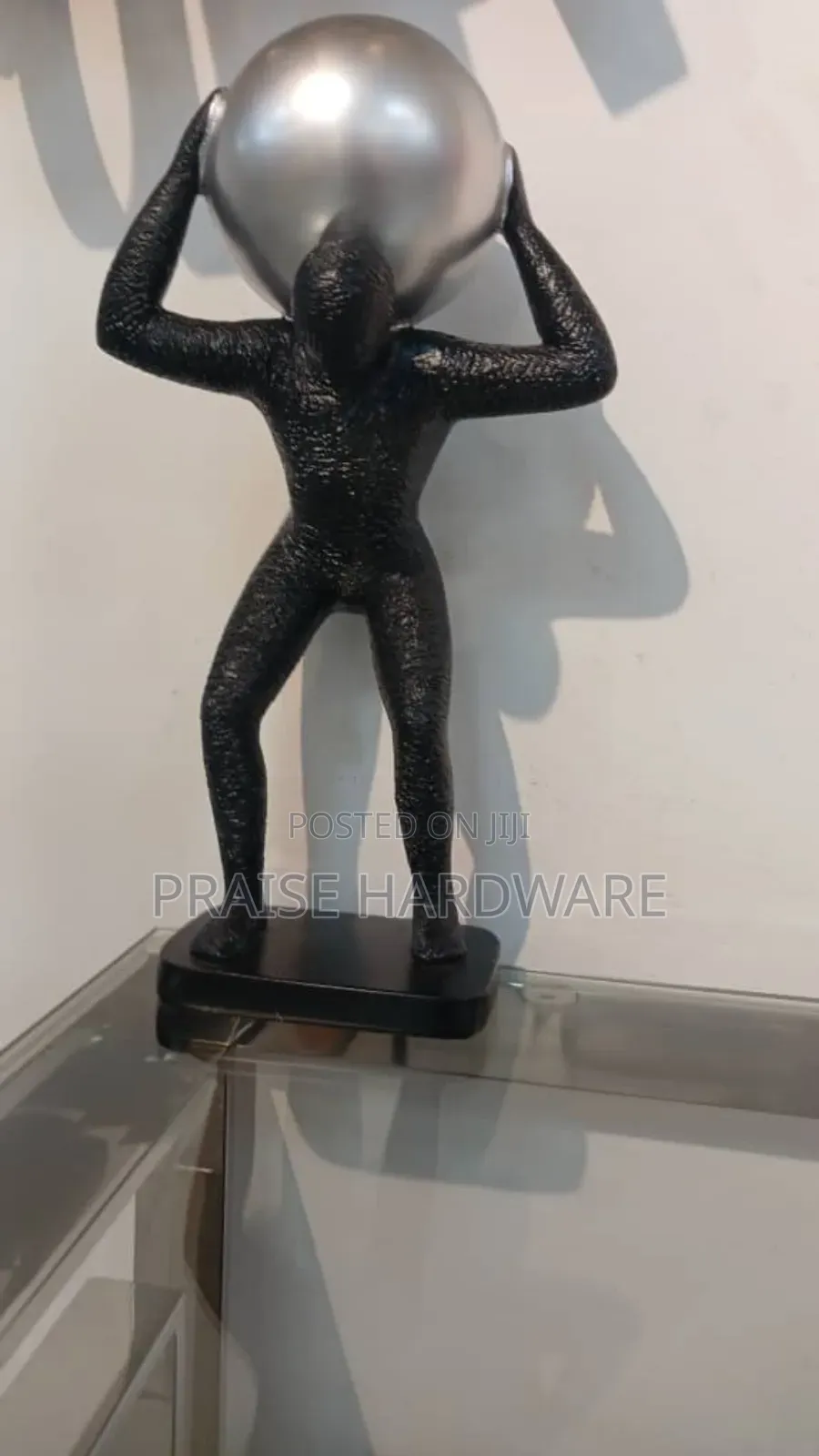 Man Carrying Globe Black