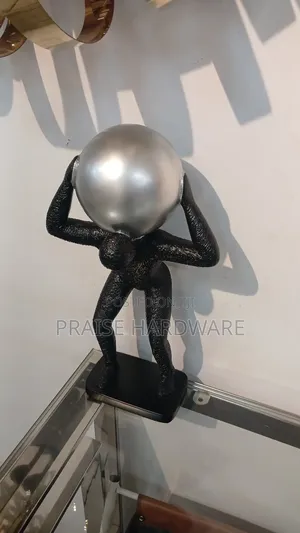 Man Carrying Globe Black