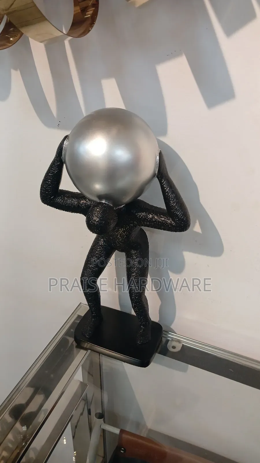 Man Carrying Globe Black