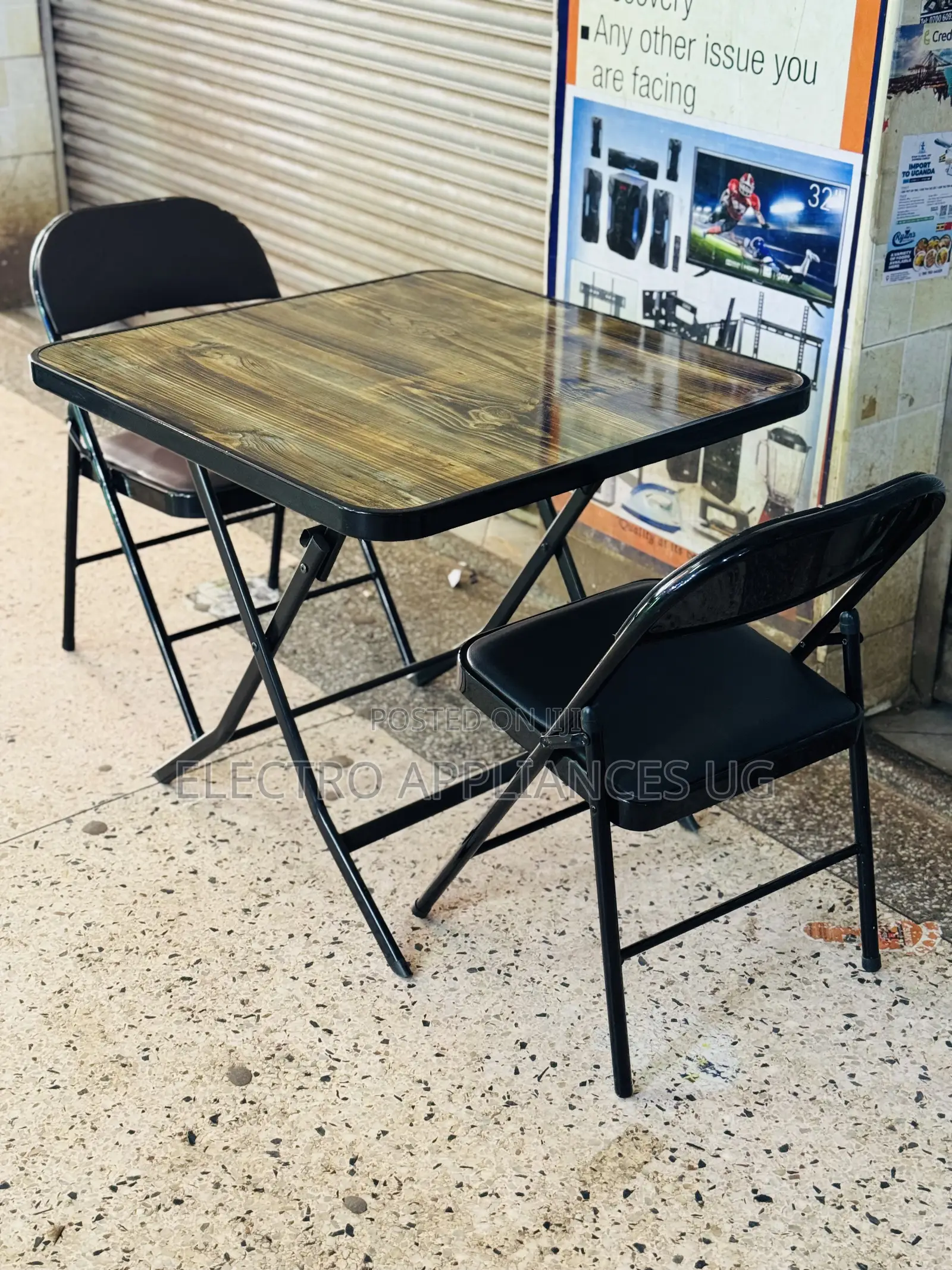 Black Padded Metal Folding Chair.