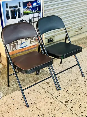 Black Padded Metal Folding Chair.