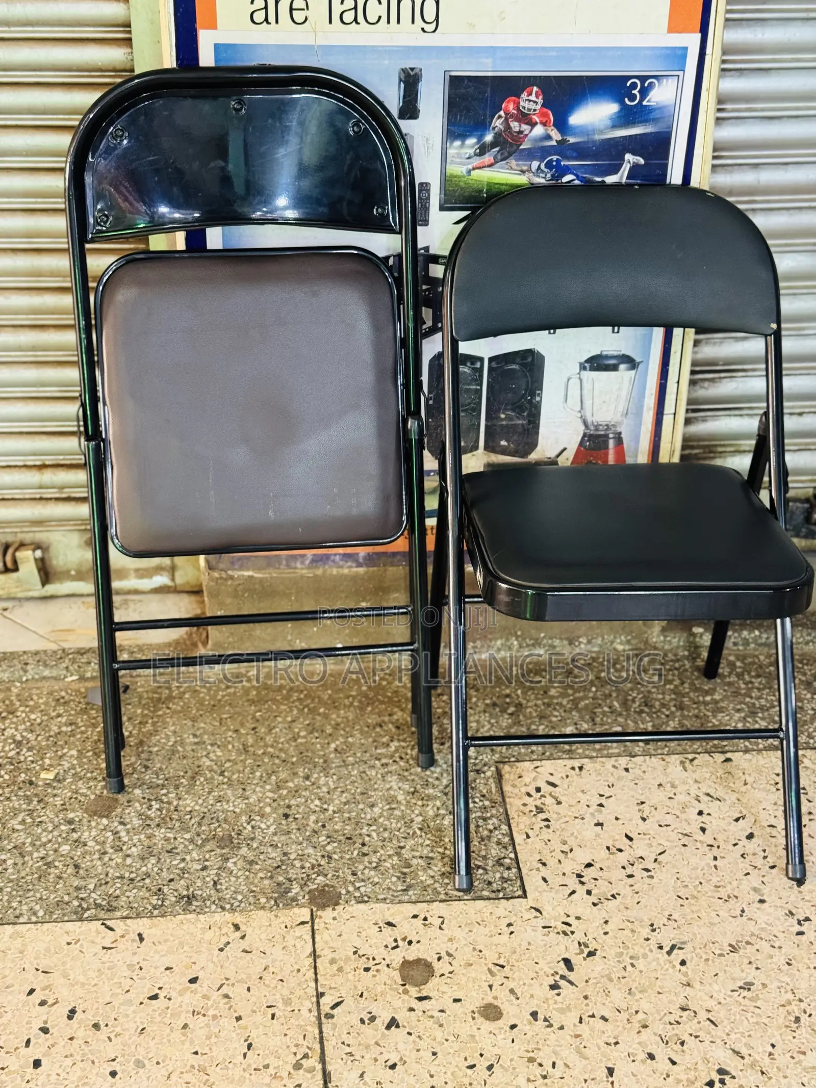 Black Padded Metal Folding Chair.