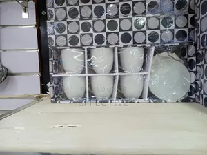 A Set of Six White Ceramic Cups and Saucers.