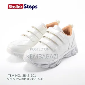 Apair of Stellar Steps White School Sneakers