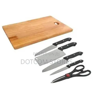 A Set of Kitchen Knives and a Wooden Chopping Board