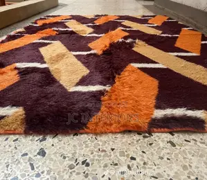 Patched Orange Fluffy Carpet