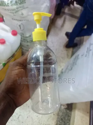 Pet Plastic Bottle With A Yellow Pump Dispenser.