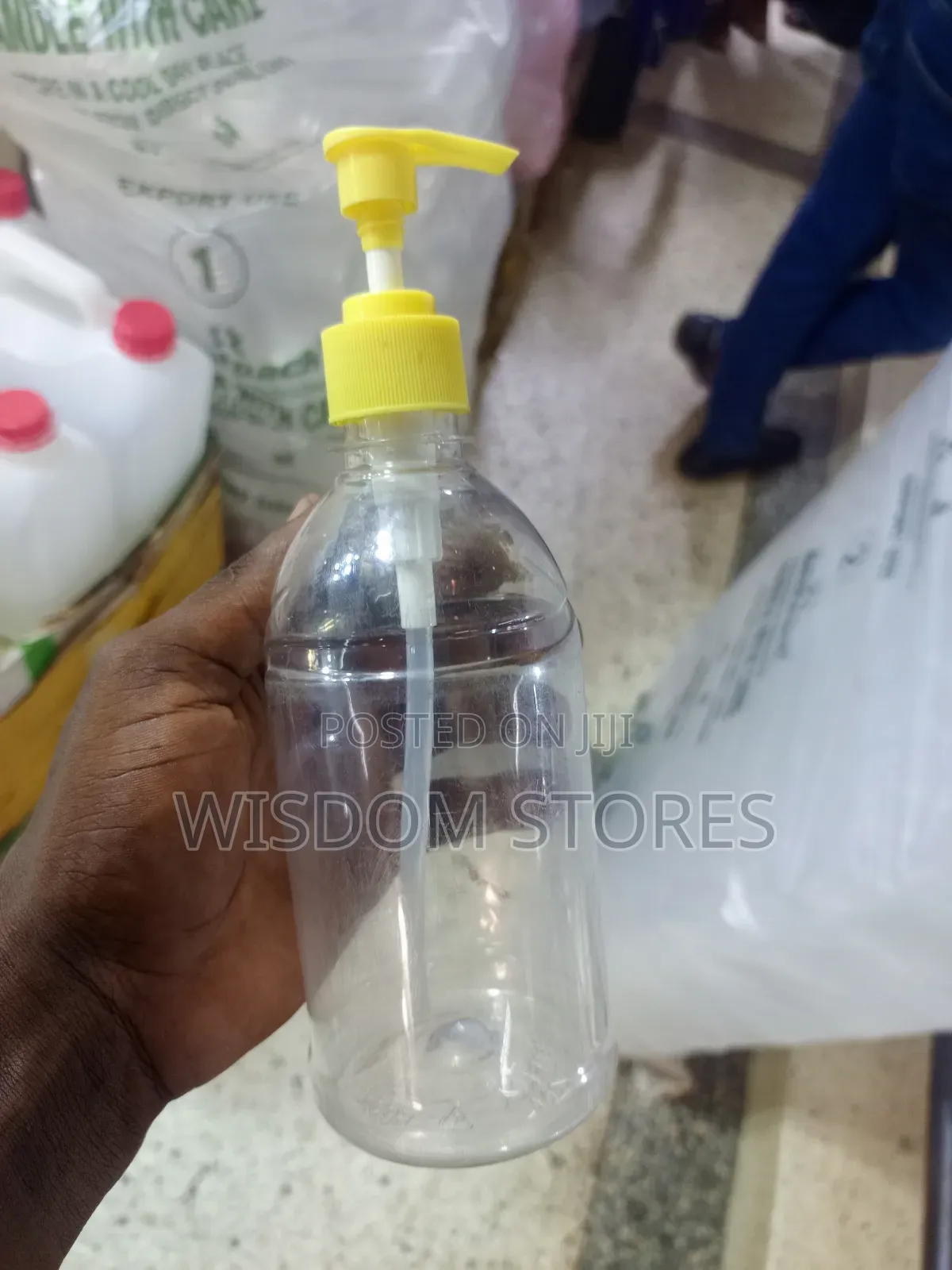 Pet Plastic Bottle With A Yellow Pump Dispenser.