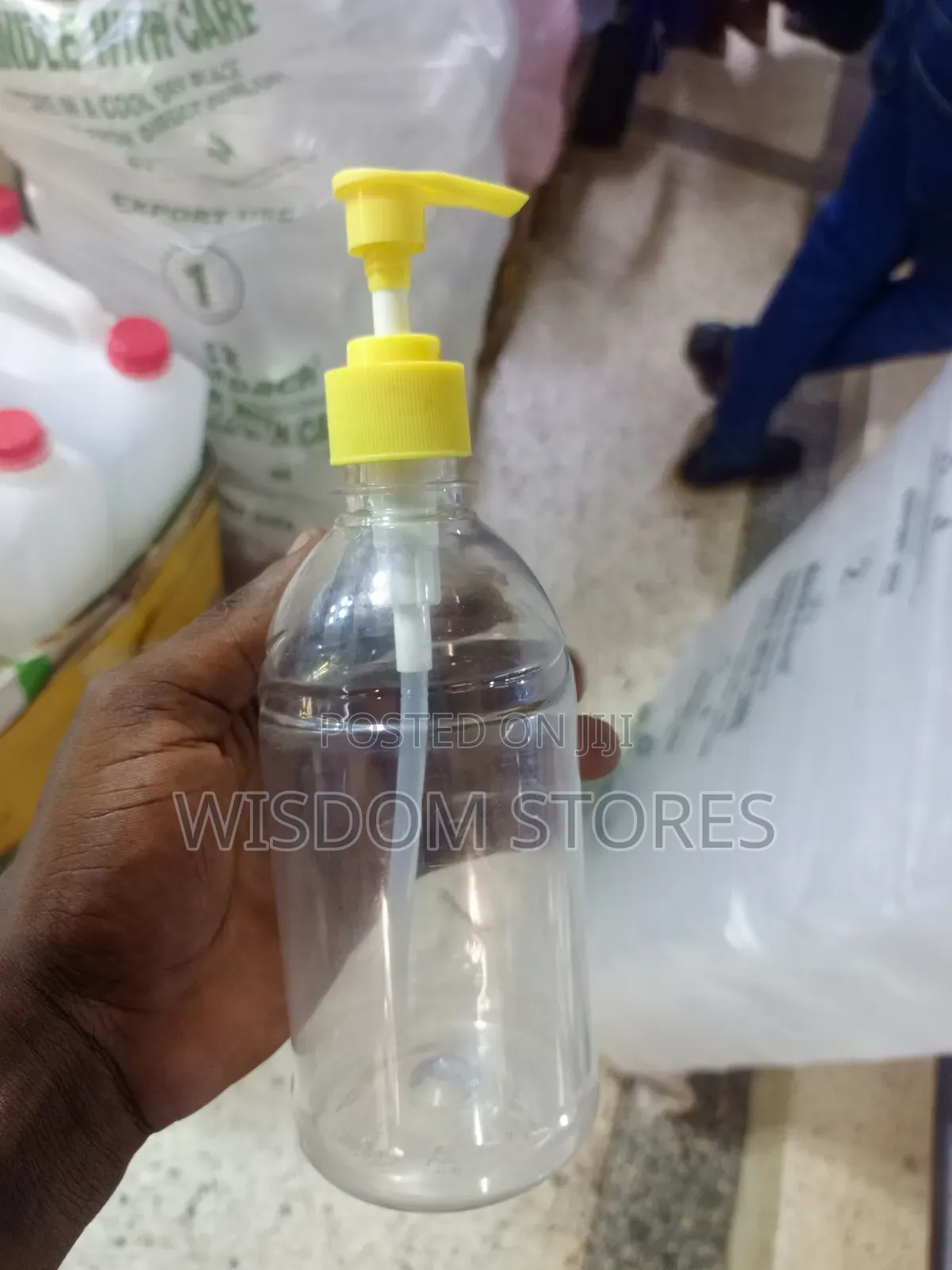 Pet Plastic Bottle With A Yellow Pump Dispenser.
