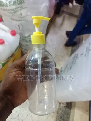 Pet Plastic Bottle With A Yellow Pump Dispenser.