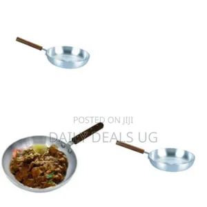 An Aluminum Frying Pan With a Wooden Handle
