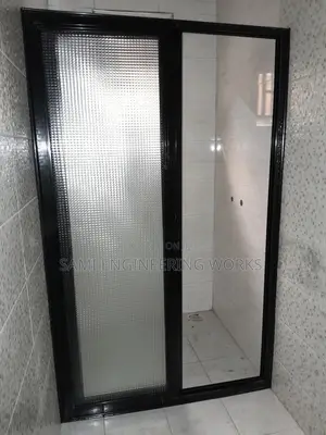 A Black Slidding Shower Divider Aluminum