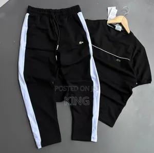 Lacoste Tracksuit Black Track Pants With White Piping Details.