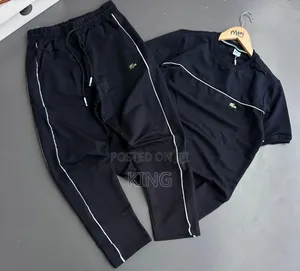 Lacoste Tracksuit Black Track Pants With White Piping Details.