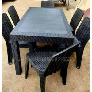 This Is a Black, Six-Seater Plastic Rattan Dining Set.