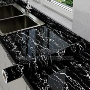 Roll of Self-Adhesive, Peel--Stick Marble Contact Paper or Wallpaper.