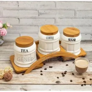 Canister Set With Bamboo Lids and a Wooden Arc Stand.