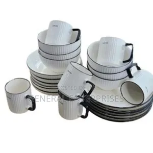 24-Piece Cream Ceramic Dinner Set With a Black Line Design.
