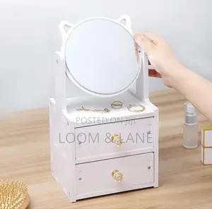 Cosmetic Organizer With a Rotating Mirror and Two Drawers