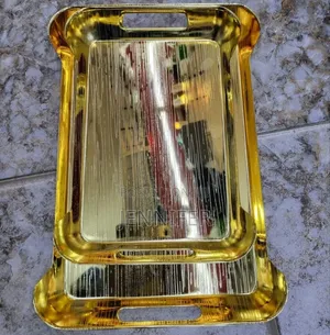 Gold-Toned Metal Serving Trays.