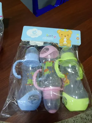 Set of Three Plastic Baby Feeding Bottles.