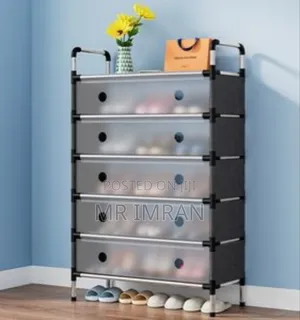 Black Multi-layer Shoe Rack With A Dustproof Cover.