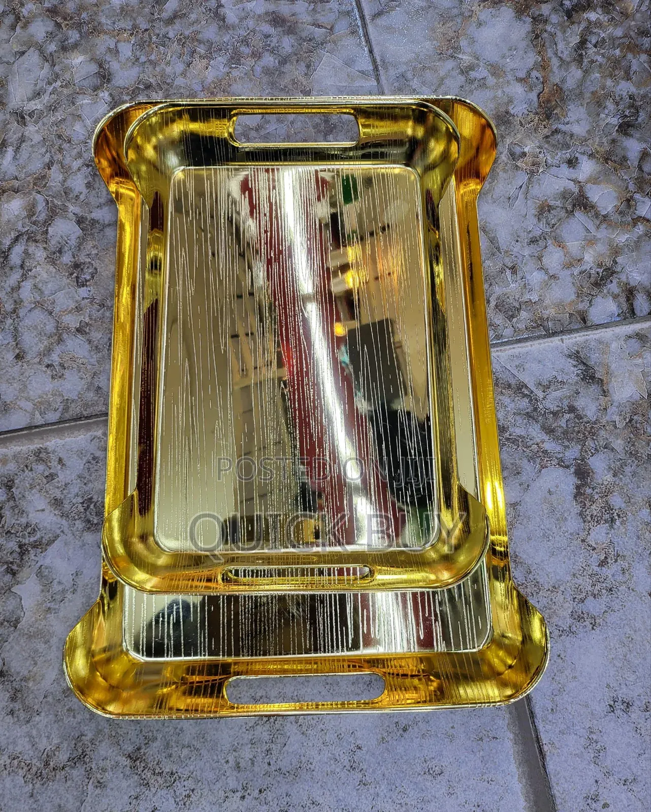 Gold-Toned Metal Serving Trays.